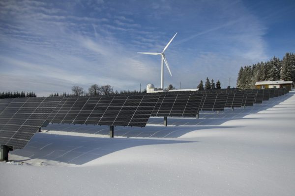 solar-panels-and-wind-turbine-in-a-snowy-landscape-showcasing-renewable-energy-sources.-433308-2048x1365